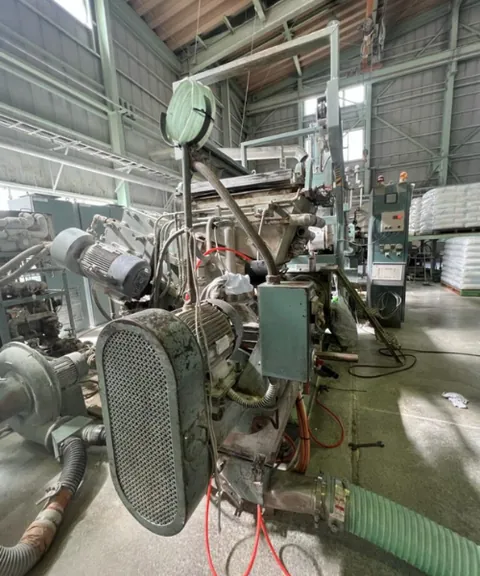 Industrial machinery in a large processing plant.