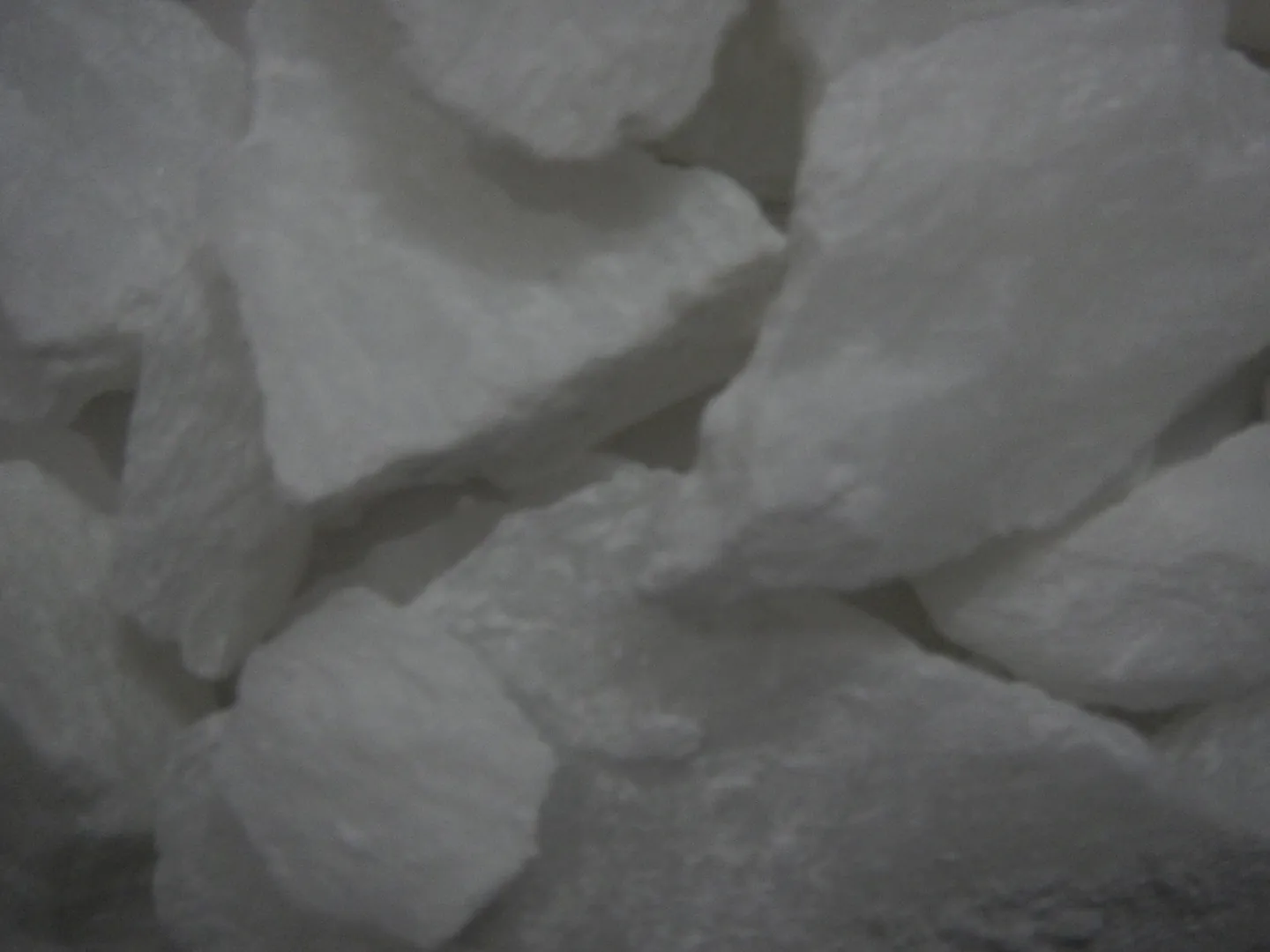 Soft-focus close-up of white talc lumps.