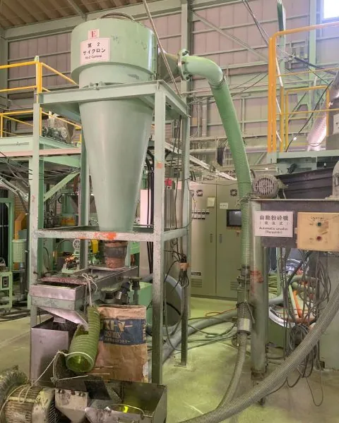 Micronizing classifier with cyclone and piping in a processing plant.